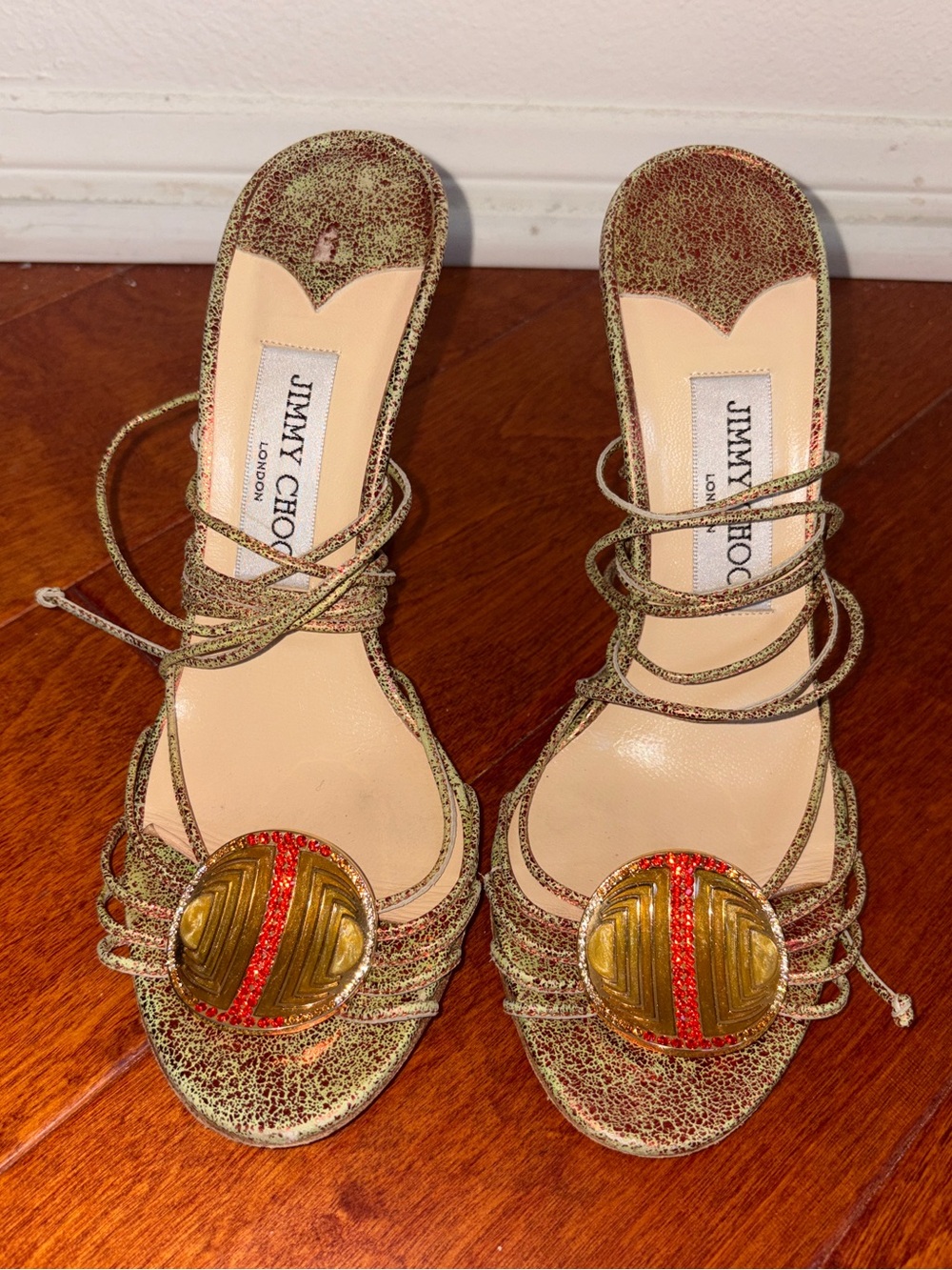 JIMMY CHOO Gold Embellished Metallic Strappy Sandals w/ Medallion